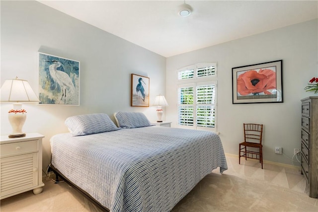 bedroom with light colored carpet