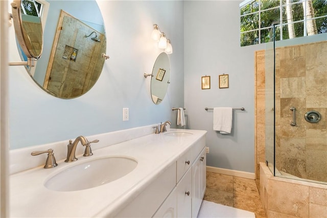 bathroom with an enclosed shower and vanity