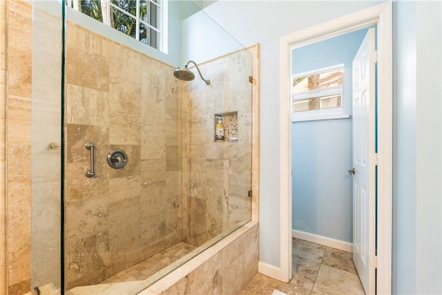 bathroom with tiled shower