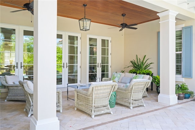 view of patio / terrace featuring ceiling fan and french doors