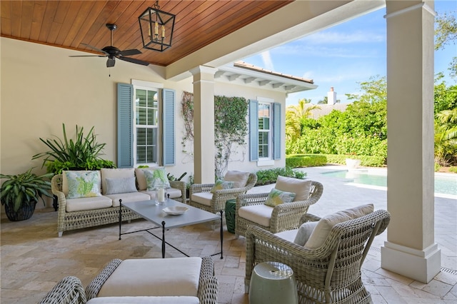 view of patio featuring an outdoor pool, ceiling fan, and an outdoor hangout area