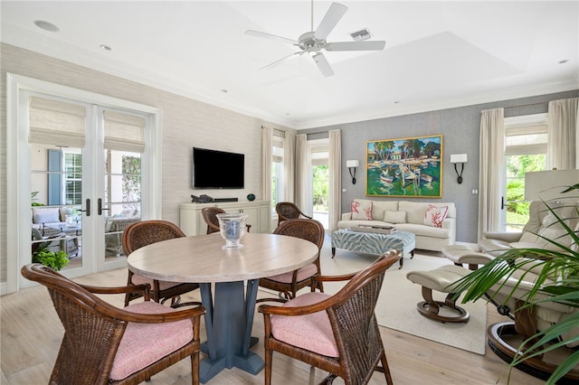 dining space featuring visible vents, ornamental molding, a wealth of natural light, and french doors