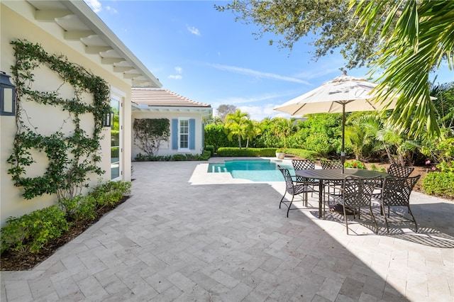 pool with a patio area