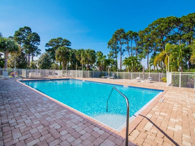 view of swimming pool featuring a patio area