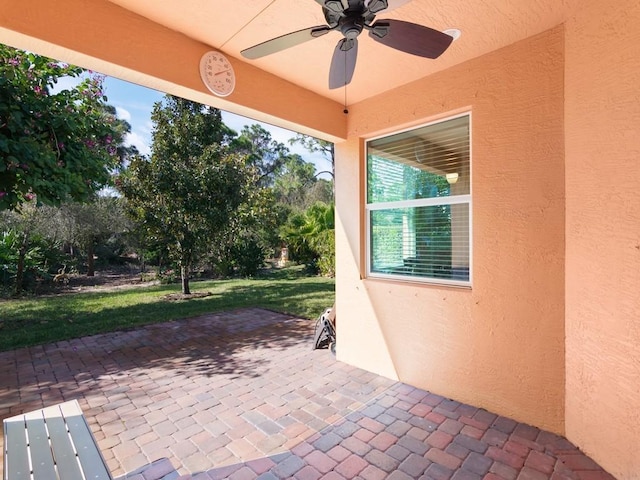 view of patio / terrace featuring ceiling fan