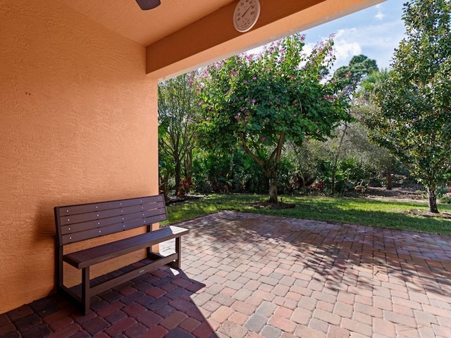 view of patio / terrace featuring ceiling fan