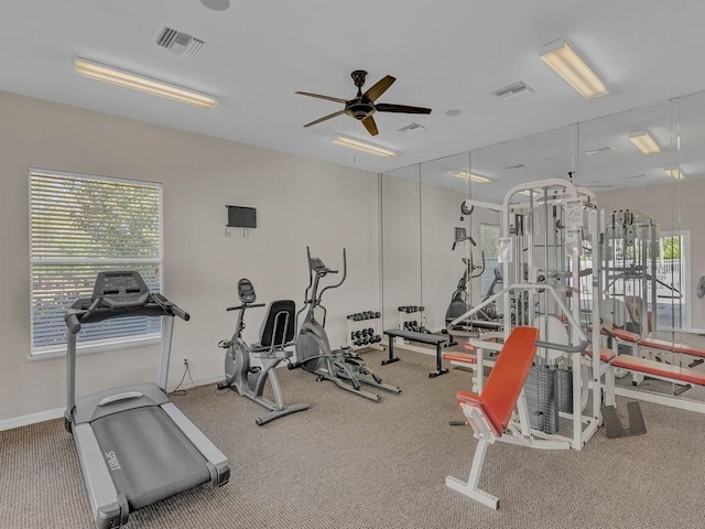 exercise room with ceiling fan