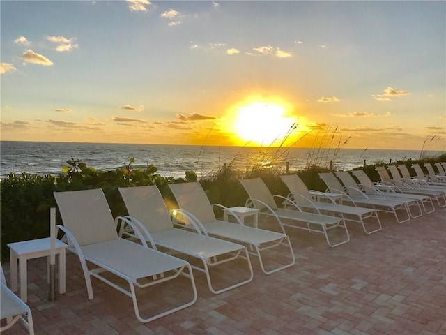 patio terrace at dusk with a water view