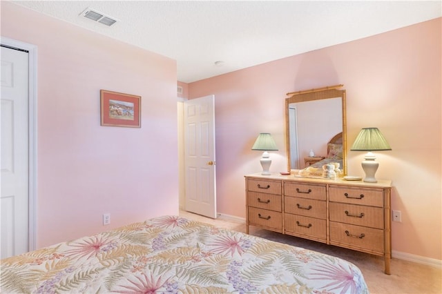 bedroom with light colored carpet