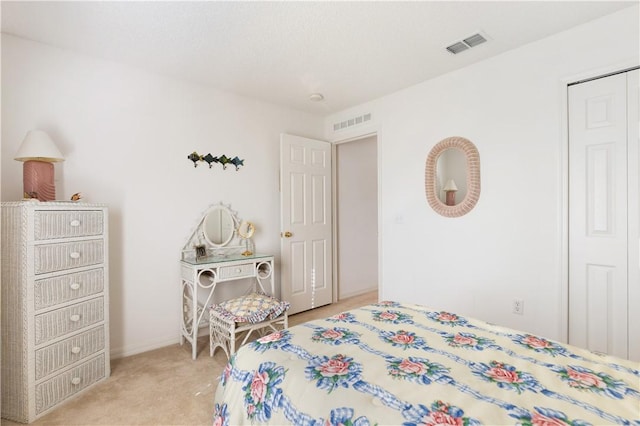 bedroom with light colored carpet