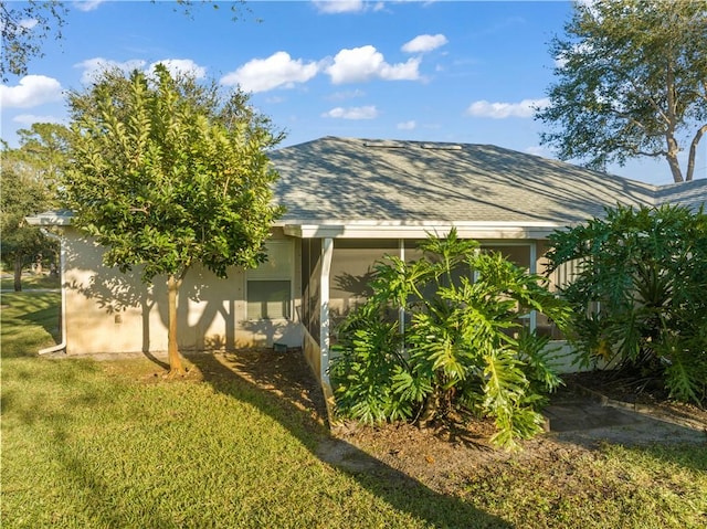 view of home's exterior featuring a lawn