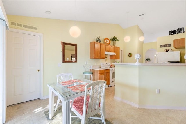 dining room with vaulted ceiling