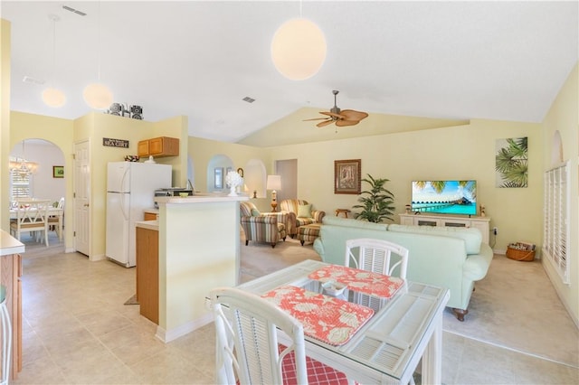 dining area featuring ceiling fan and vaulted ceiling