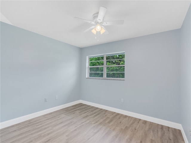 unfurnished room with ceiling fan and light hardwood / wood-style floors