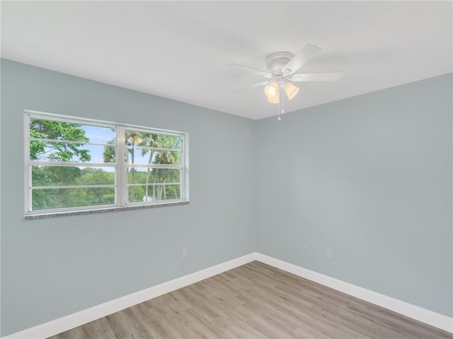 unfurnished room with ceiling fan and light hardwood / wood-style floors