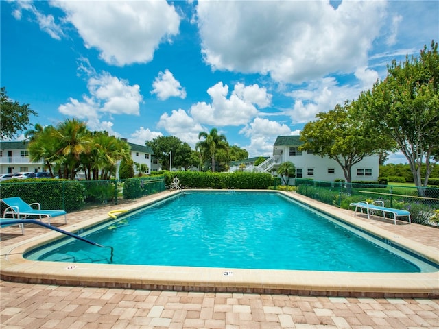 view of swimming pool with a patio