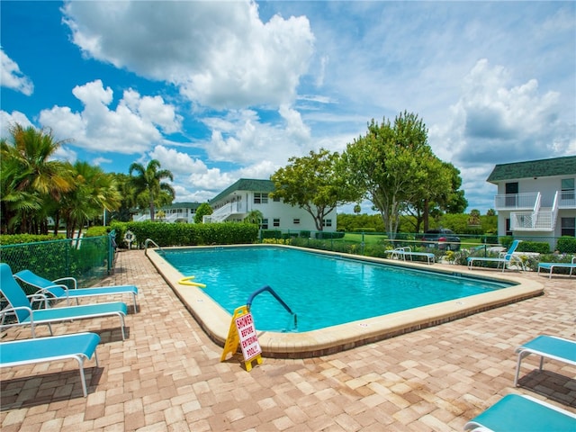 view of swimming pool with a patio area