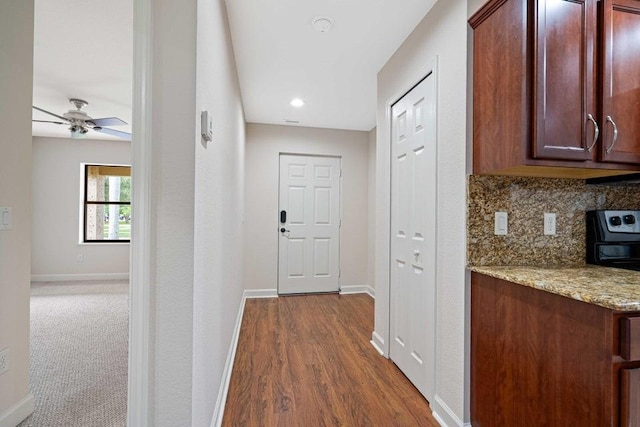 hall with dark hardwood / wood-style floors