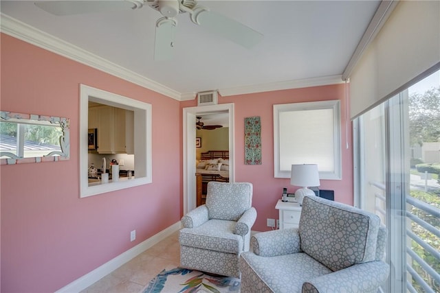 sitting room with ornamental molding and a healthy amount of sunlight