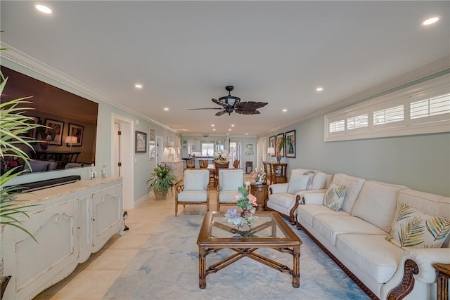 living room with ceiling fan, light tile patterned flooring, and crown molding