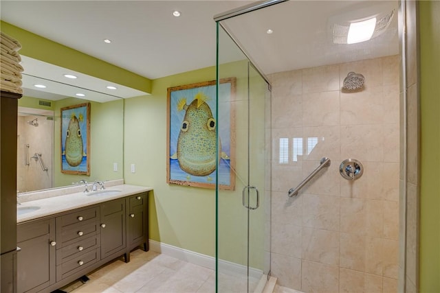 bathroom with a shower with door, tile patterned flooring, and vanity