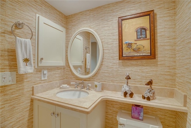 bathroom with toilet and vanity