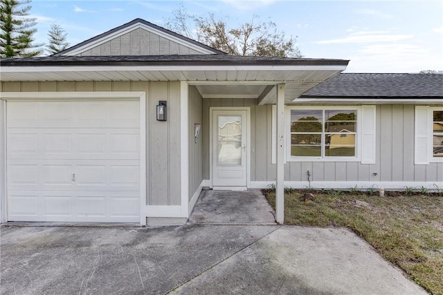 doorway to property featuring a garage