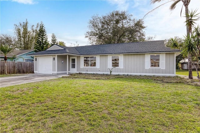 ranch-style house with a garage and a front yard