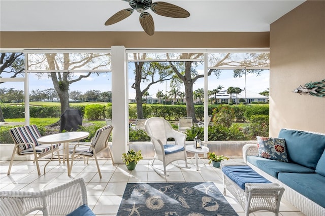 sunroom with ceiling fan and plenty of natural light