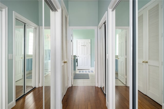 hallway with dark wood-style flooring