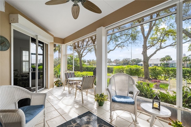 sunroom / solarium with ceiling fan