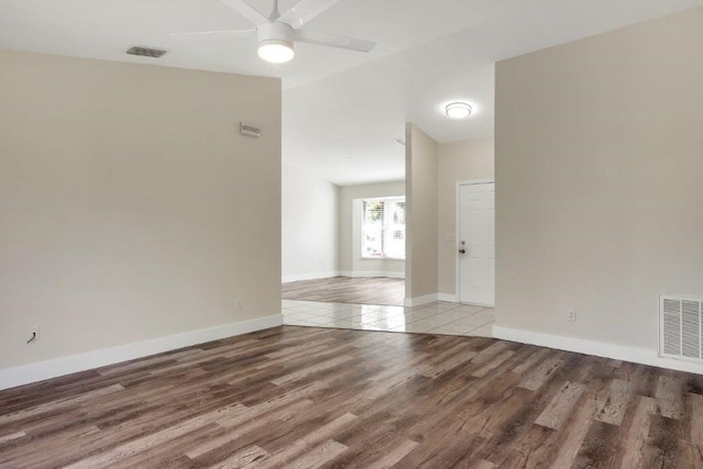 unfurnished room featuring hardwood / wood-style flooring and ceiling fan