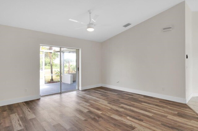 unfurnished room featuring ceiling fan, vaulted ceiling, and wood-type flooring