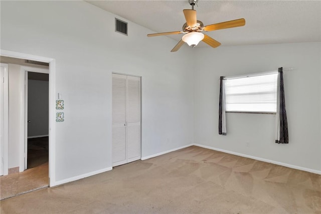 unfurnished bedroom with visible vents, a ceiling fan, a closet, carpet flooring, and baseboards