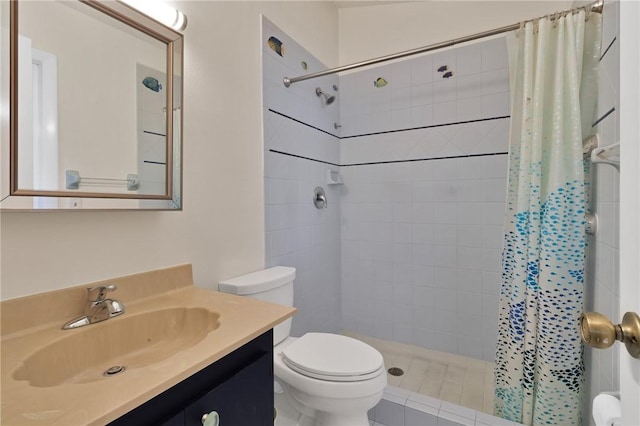 bathroom featuring vanity, toilet, and a tile shower