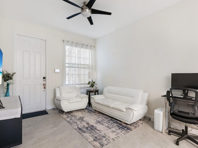 office space featuring ceiling fan and light tile patterned floors