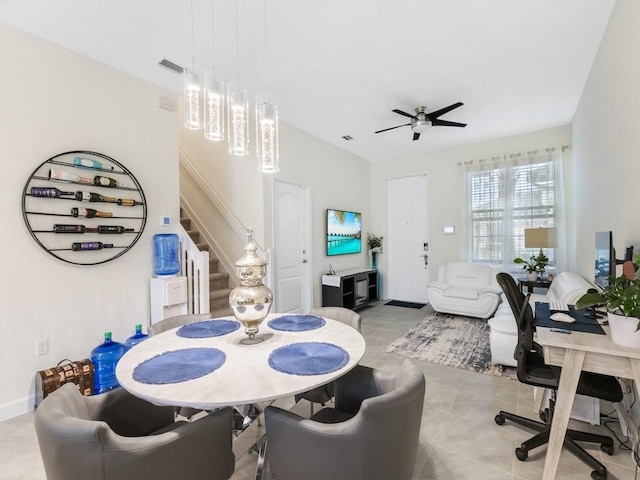 dining space with ceiling fan