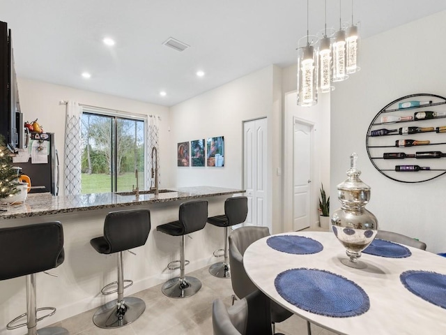 dining area featuring sink