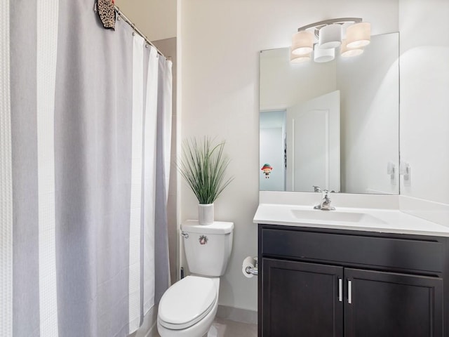 bathroom with toilet and vanity