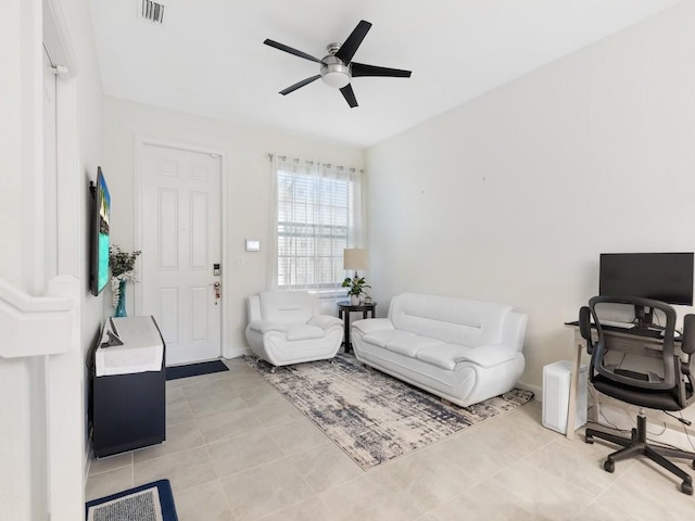 interior space featuring ceiling fan and light tile patterned floors