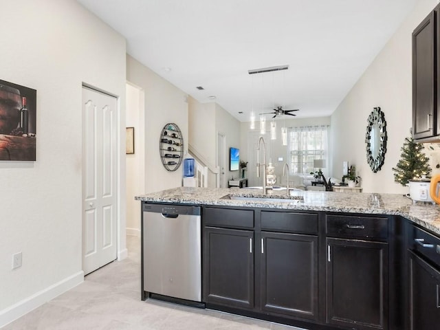 kitchen featuring sink, light stone counters, ceiling fan, light tile patterned floors, and stainless steel dishwasher