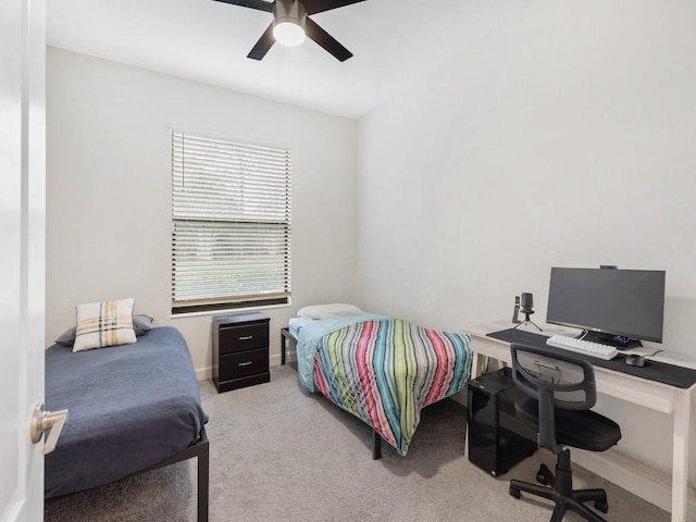 bedroom with light colored carpet and ceiling fan