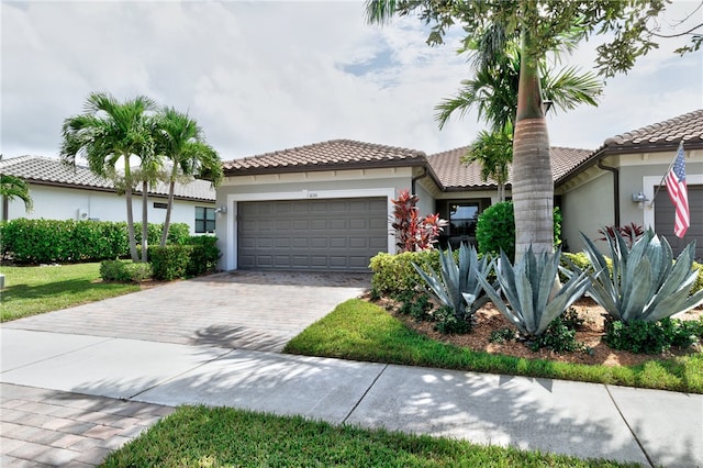 mediterranean / spanish-style house featuring a garage