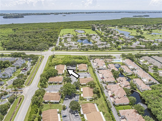 bird's eye view with a water view and a residential view