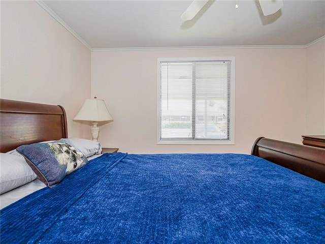 bedroom featuring a ceiling fan and ornamental molding