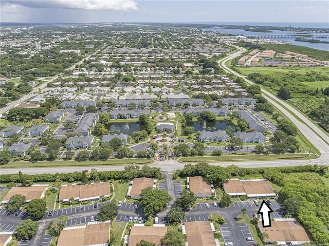 aerial view with a residential view and a water view
