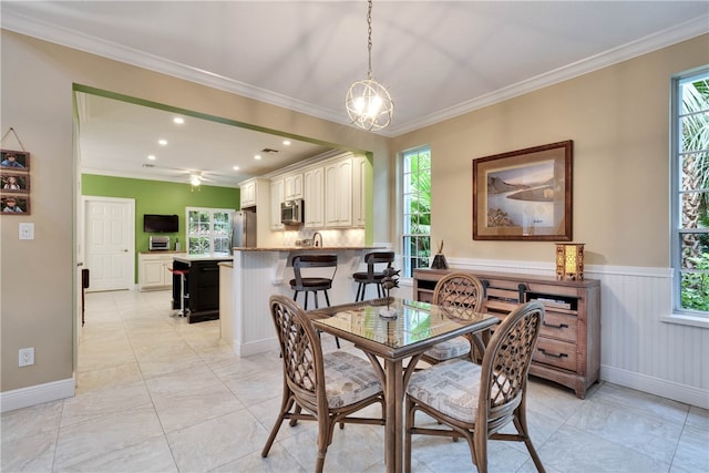 dining room featuring crown molding