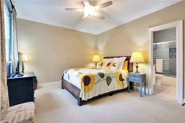 carpeted bedroom featuring ornamental molding, ensuite bathroom, and ceiling fan