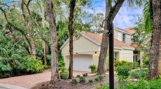 view of side of property with a garage