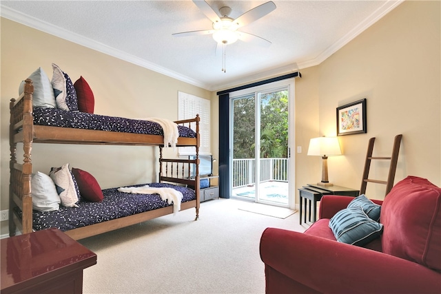 carpeted bedroom featuring ornamental molding, access to outside, and ceiling fan